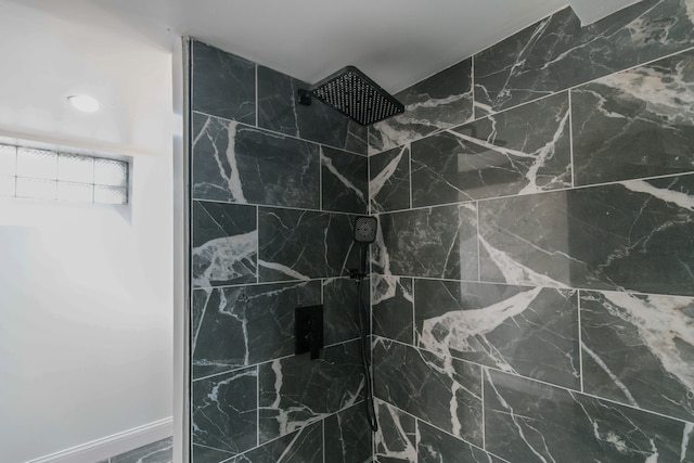 bathroom featuring tiled shower