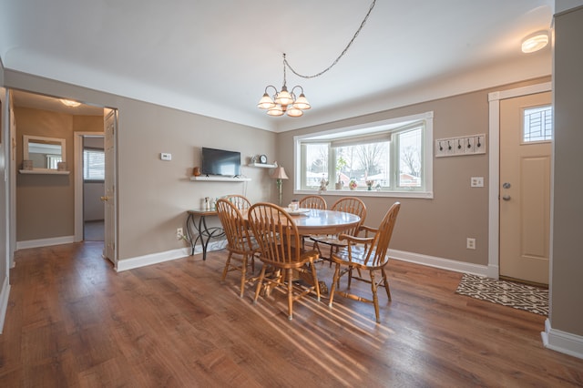 dining room with a chandelier and wood-type flooring