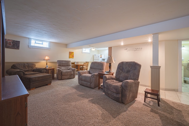 living room with carpet floors and a textured ceiling