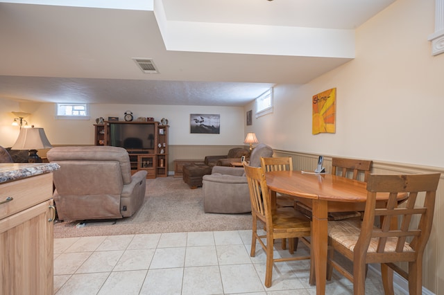 dining space with light tile patterned floors