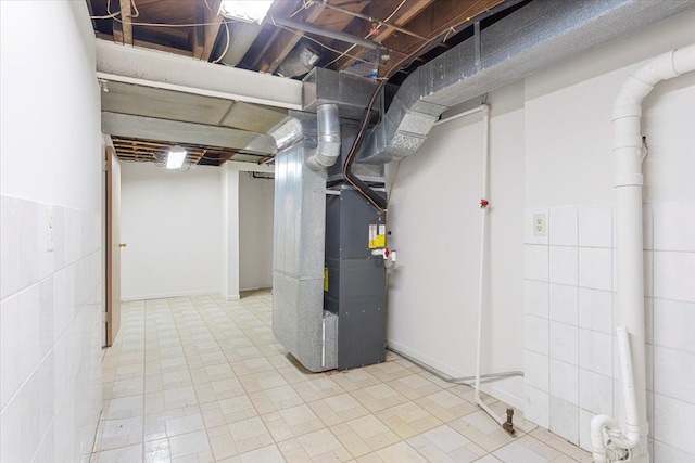 basement featuring heating unit