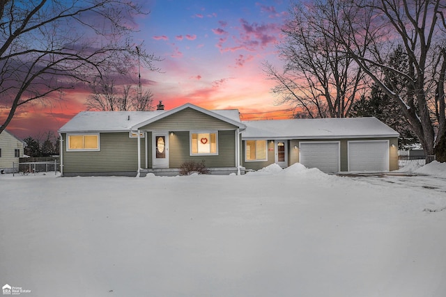 single story home featuring a garage