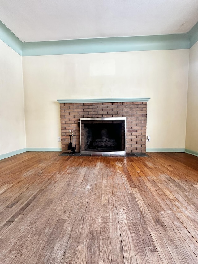 room details with a fireplace and wood-type flooring