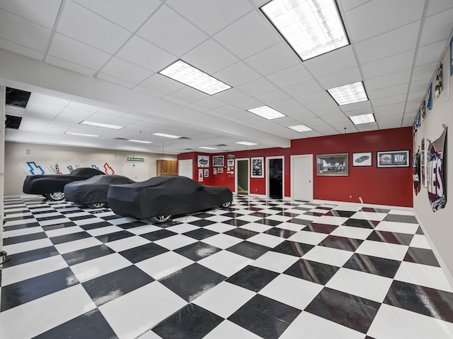 interior space featuring a drop ceiling