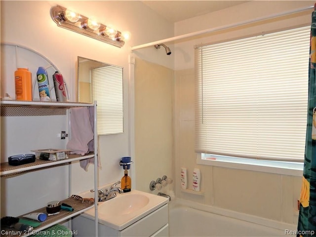 bathroom with vanity and shower / bathing tub combination