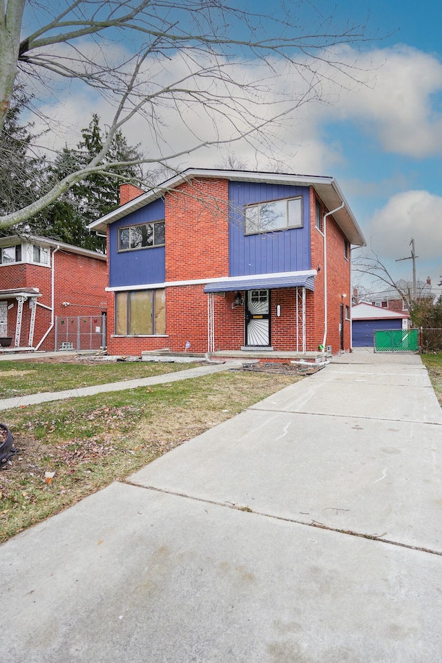 view of front of home featuring a garage and an outdoor structure