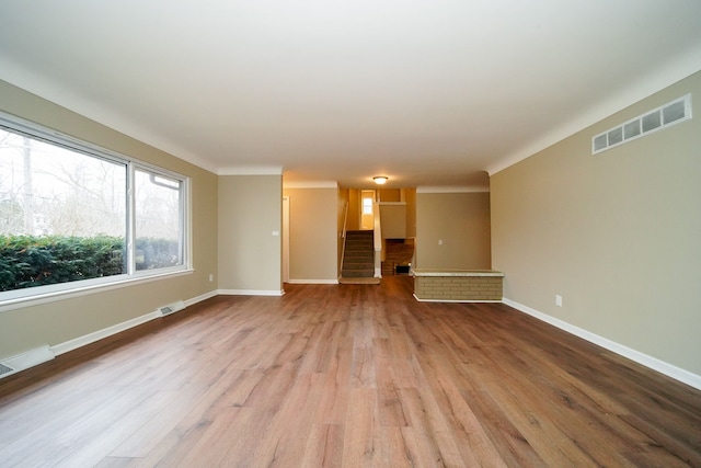 unfurnished living room with light hardwood / wood-style floors