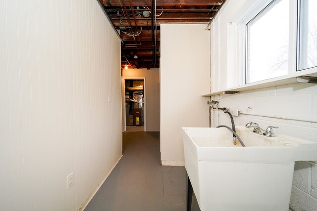 clothes washing area with sink