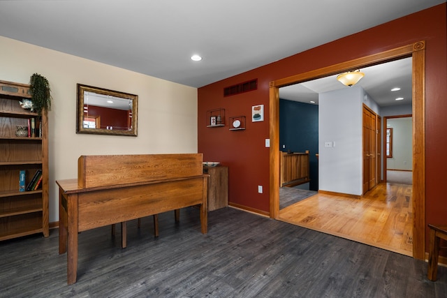 dining room featuring recessed lighting, wood finished floors, visible vents, and baseboards