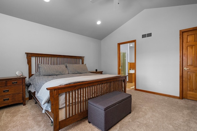 bedroom with visible vents, ensuite bath, baseboards, lofted ceiling, and light colored carpet