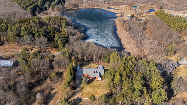 birds eye view of property featuring a water view and a view of trees