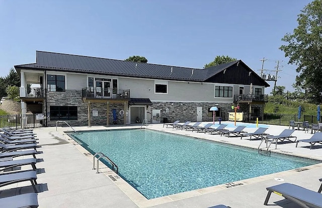 view of pool featuring a patio area