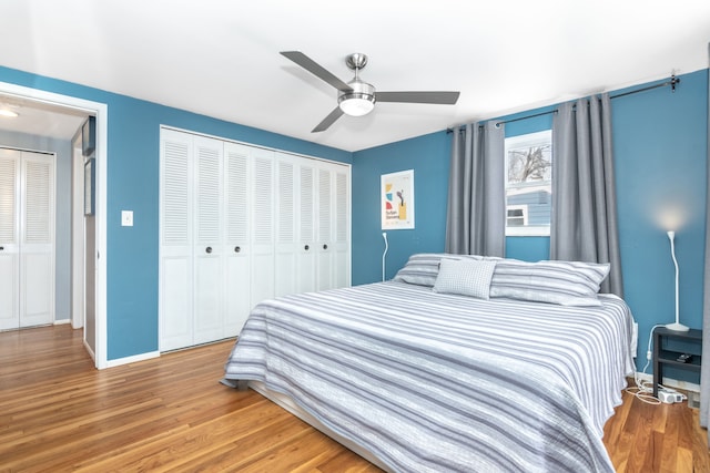 bedroom with baseboards, a closet, a ceiling fan, and wood finished floors