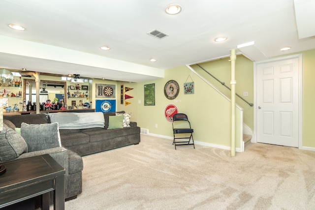 living room with carpet floors, stairway, visible vents, and baseboards