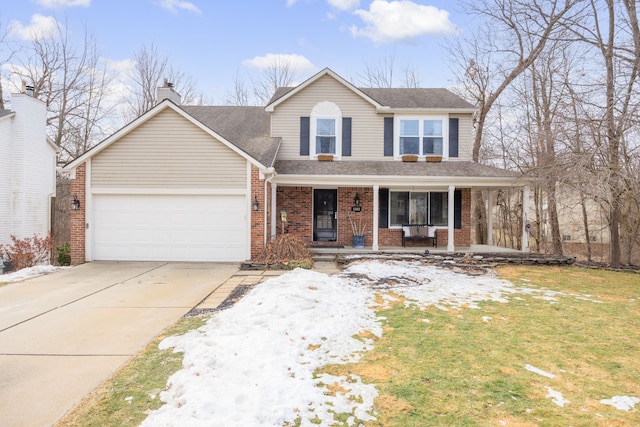 traditional-style home featuring driveway, a porch, an attached garage, brick siding, and a chimney