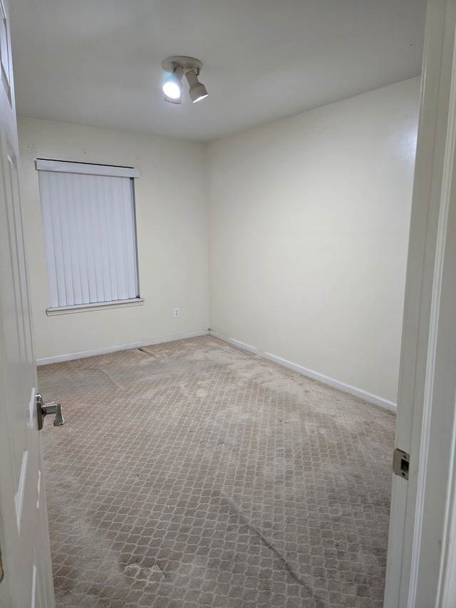 spare room featuring carpet floors