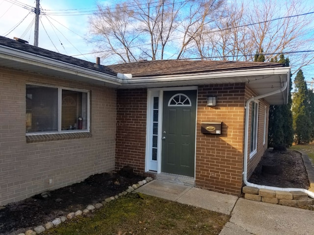 property entrance with brick siding