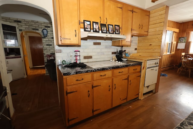 1022 Lorene Ave, Mount Morris, MI 48458 - kitchen featuring white stovetop, backsplash, wooden walls, and dark hardwood / wood-style flooring