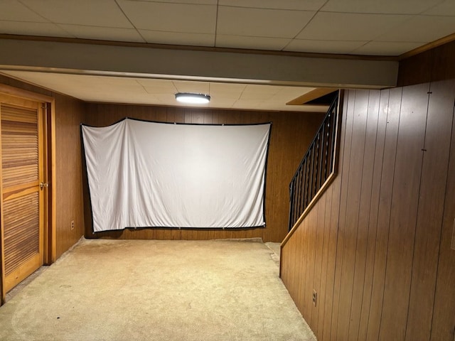 1022 Lorene Ave, Mount Morris, MI 48458 - basement with a paneled ceiling, wood walls, and light colored carpet