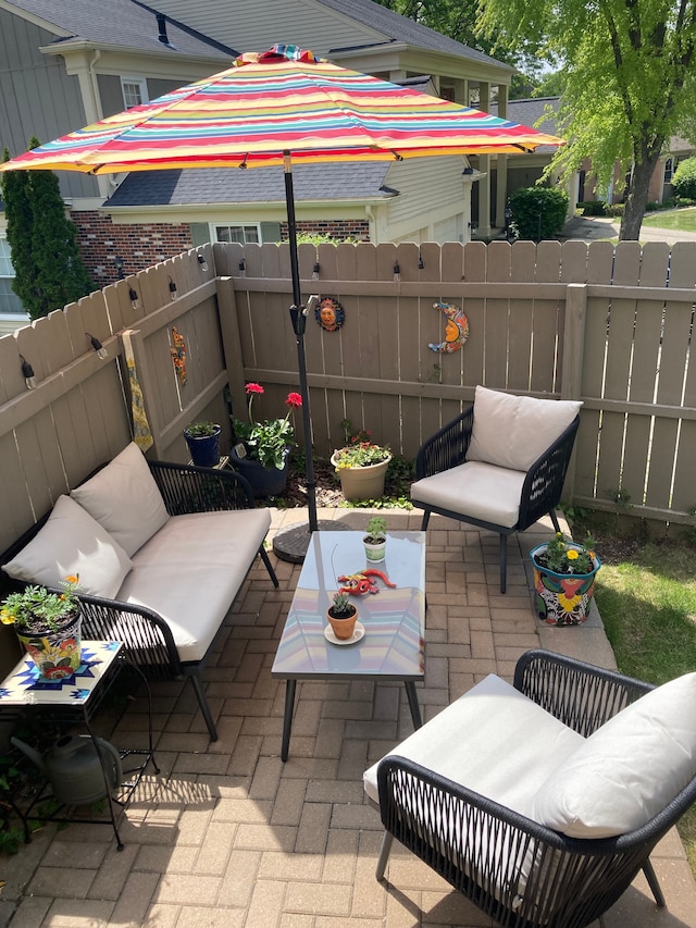 view of patio / terrace featuring an outdoor living space and a fenced backyard