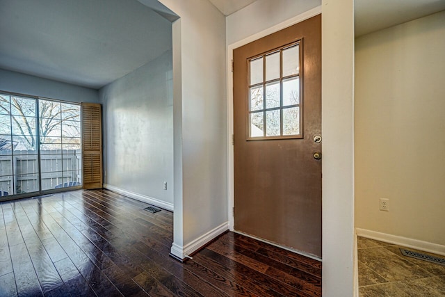 entryway with plenty of natural light, visible vents, baseboards, and hardwood / wood-style floors