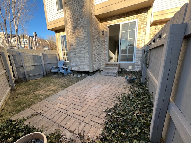 view of patio / terrace with a fenced backyard and entry steps