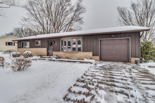 single story home with a garage