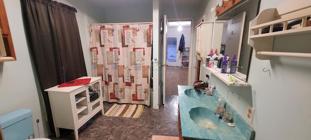 bathroom featuring vanity and toilet