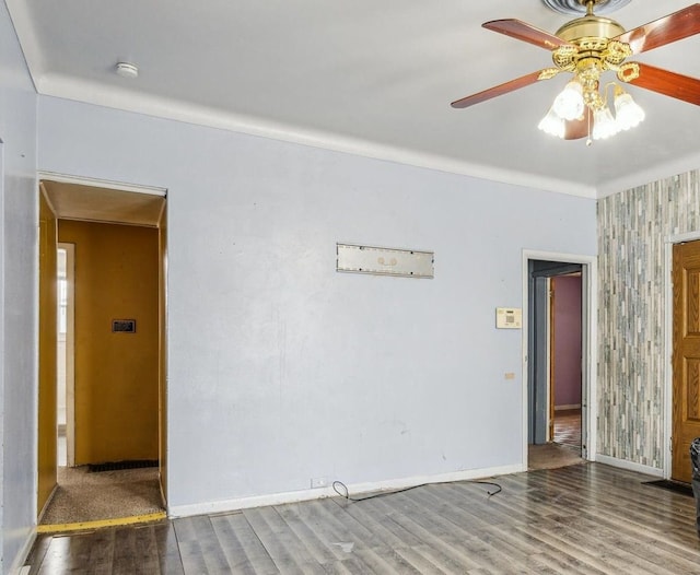 unfurnished room with hardwood / wood-style flooring and ceiling fan