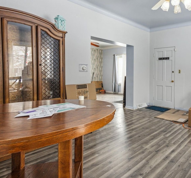 unfurnished dining area featuring hardwood / wood-style flooring and ceiling fan