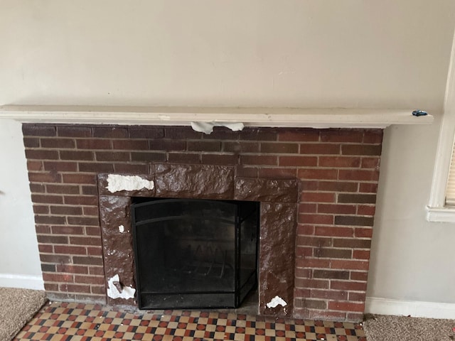 room details featuring a brick fireplace