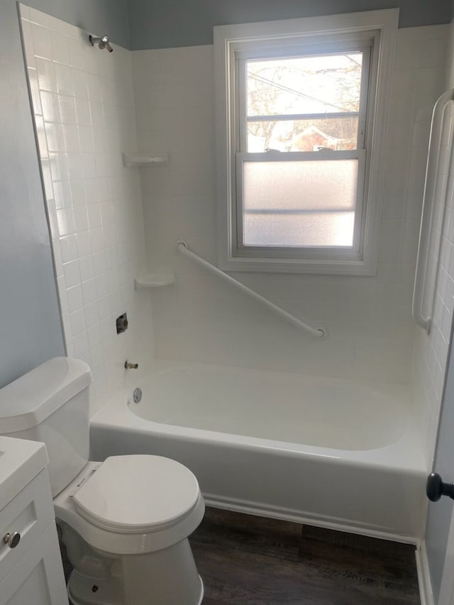 full bathroom featuring vanity, hardwood / wood-style floors,  shower combination, and toilet