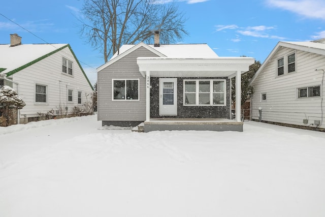 view of snow covered house