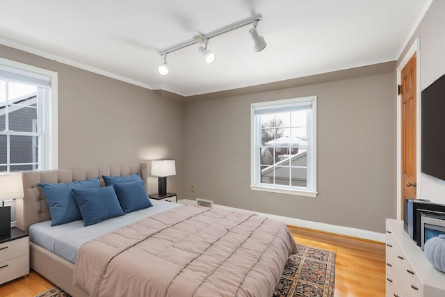 bedroom with light hardwood / wood-style floors