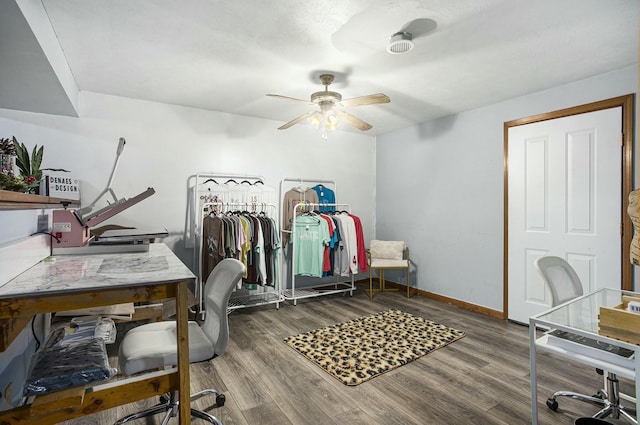 home office featuring hardwood / wood-style flooring and ceiling fan