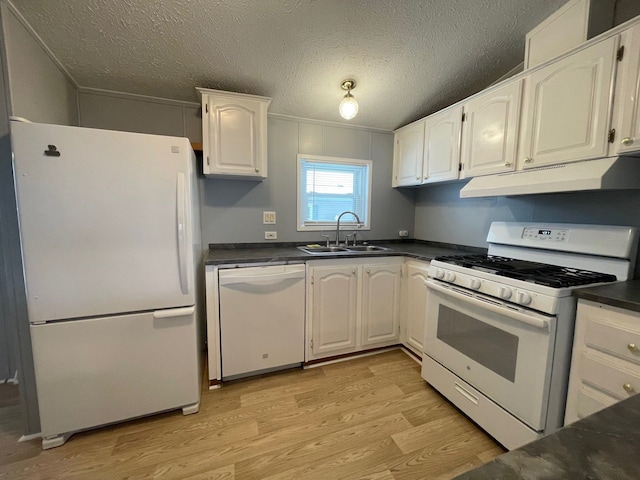 kitchen featuring white appliances, a textured ceiling, light hardwood / wood-style floors, sink, and white cabinetry