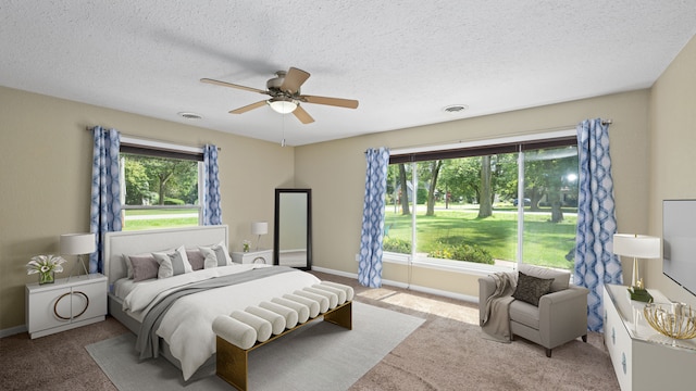 bedroom featuring light carpet, a ceiling fan, visible vents, and baseboards