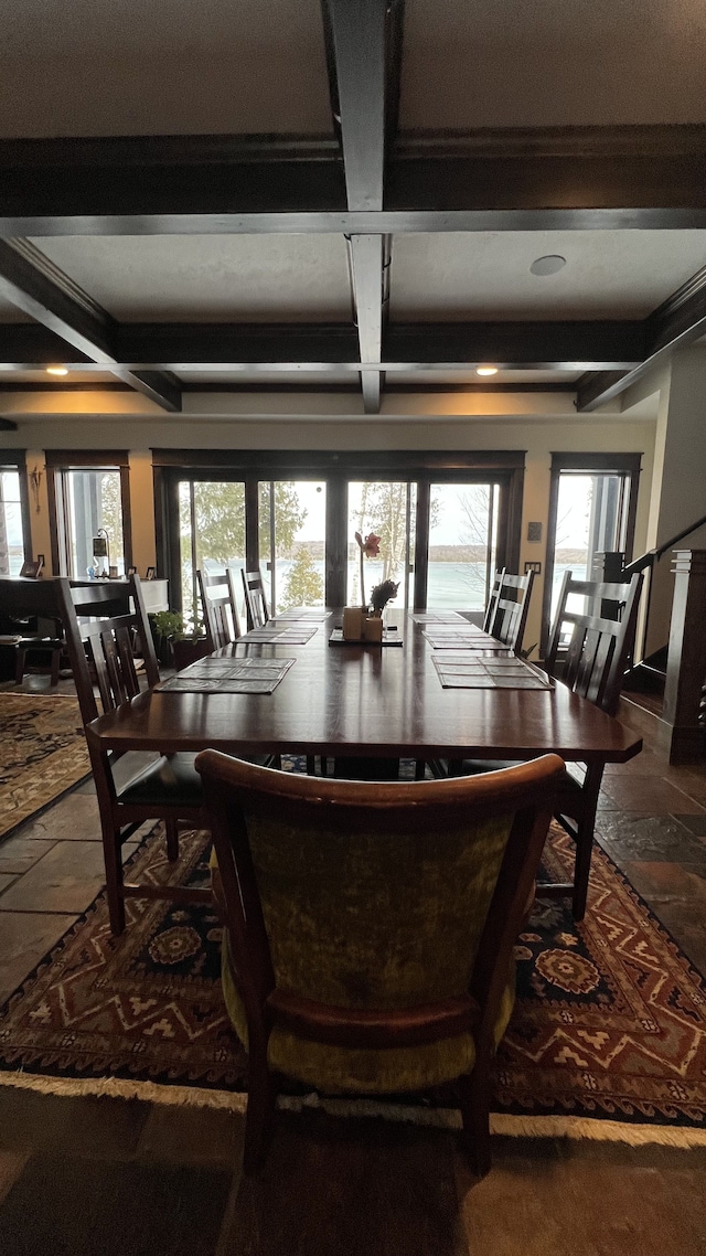 dining area with beamed ceiling and coffered ceiling