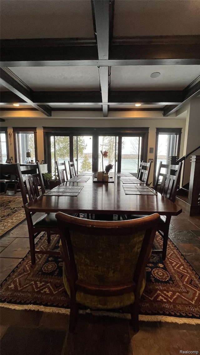 11720 Easy St, Kewadin, MI 49648 - dining space featuring coffered ceiling, beamed ceiling, and healthy amount of natural light