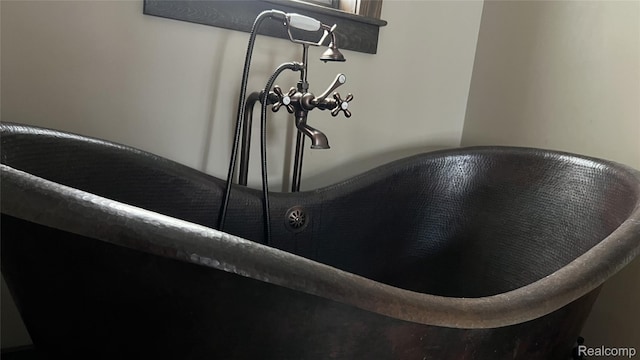 11720 Easy St, Kewadin, MI 49648 - bathroom view of a freestanding tub and a sink