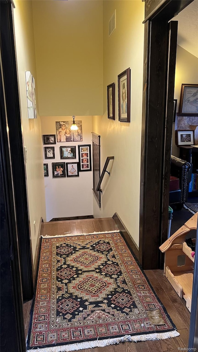11720 Easy St, Kewadin, MI 49648 - hall with an upstairs landing, a towering ceiling, and baseboards