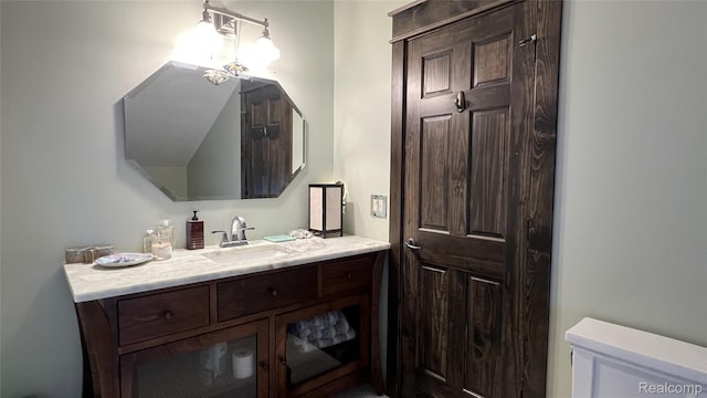 11720 Easy St, Kewadin, MI 49648 - bathroom featuring vanity and toilet