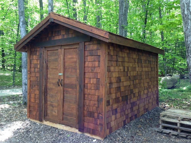 11720 Easy St, Kewadin, MI 49648 - view of shed with a wooded view