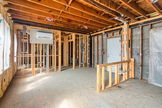 basement with a wall mounted air conditioner