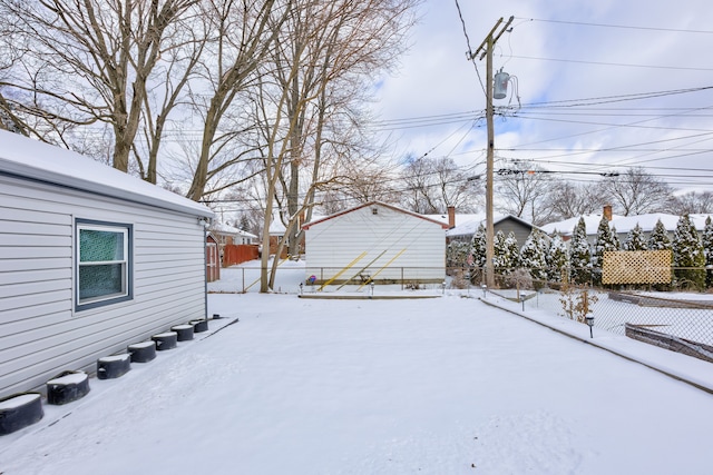 view of yard covered in snow