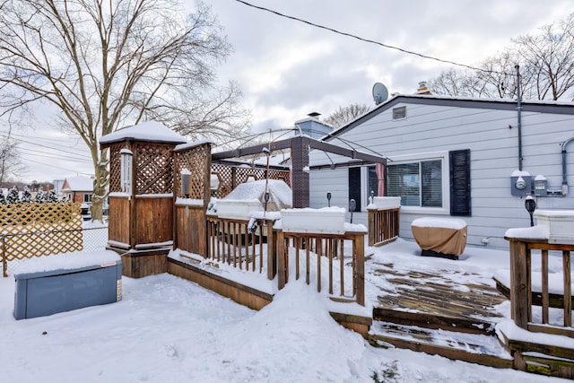 view of snow covered deck