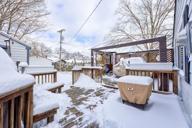 yard covered in snow with a deck and a gazebo