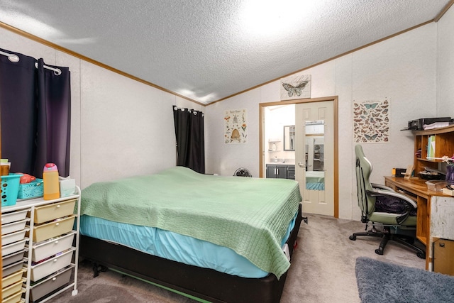 carpeted bedroom with connected bathroom, vaulted ceiling, a textured ceiling, and ornamental molding