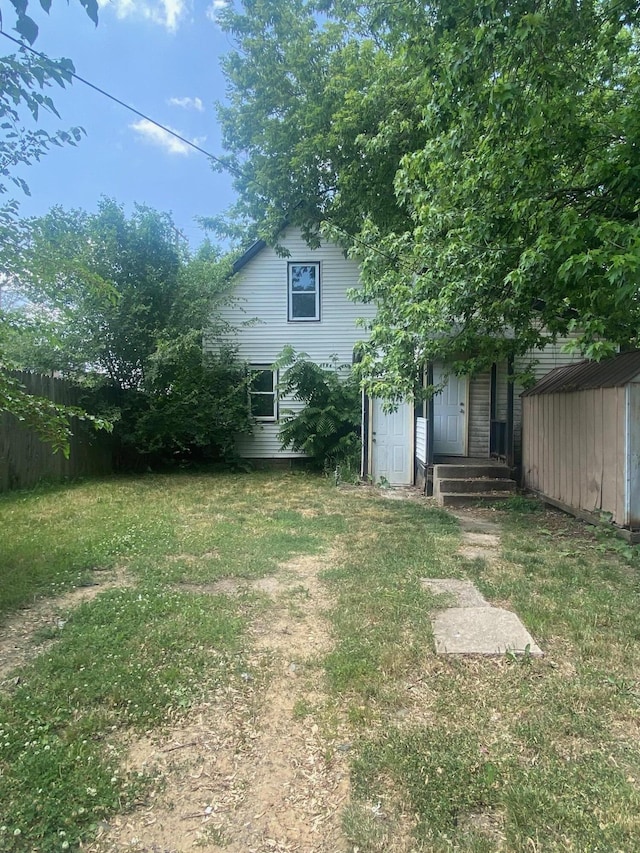 1216 NW Quarry NW, Grand Rapids, MI 49504 - view of green lawn featuring a storage unit