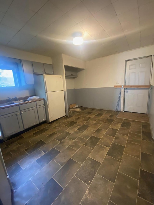 1216 NW Quarry NW, Grand Rapids, MI 49504 - kitchen featuring freestanding refrigerator, gray cabinets, and dark countertops